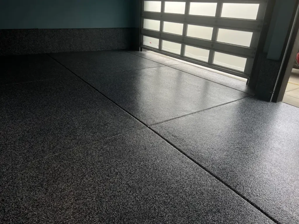 Epoxy garage floor coating with decorative flake finish in a Rochester Hills home